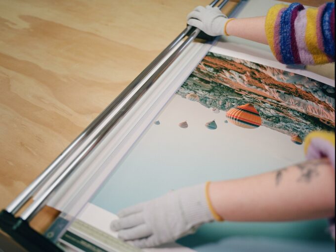 A fine art photo print being trimmed down, before framing